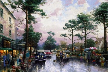 350 人の有名アーティストによるアート作品 Painting - 雨の午後のカーメル・オーシャン・アベニュー トーマス・キンケード
